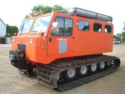 1985 DMC 1200 WT 1985 DMC 1200 WT, 10-man cab seats six with tool box, Ford 6 cyl., AT, 410 hours, top rack, 36" tracks and front 12,000 lb. winch
