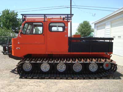 1982 DMC 1200 WT 1982 DMC 1200 WT, 5-man cab, 6 cyl., AT, 999 hours, 36" tracks, new front 12,000 lb. winch, solid wheels, top rack, and a stake side bed.